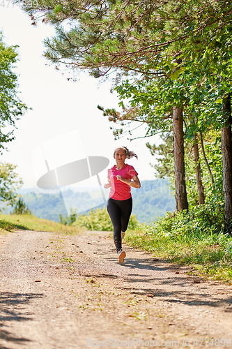 Image of woman enjoying in a healthy lifestyle while jogging