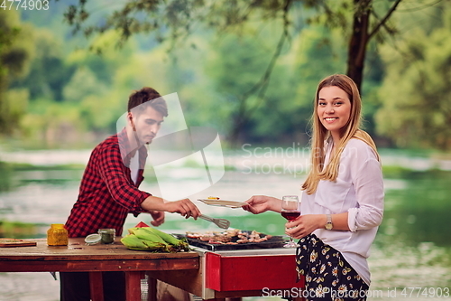 Image of man cooking tasty food for french dinner party