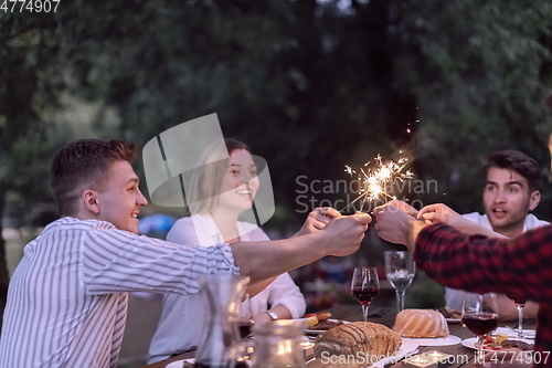 Image of french dinner party on summer