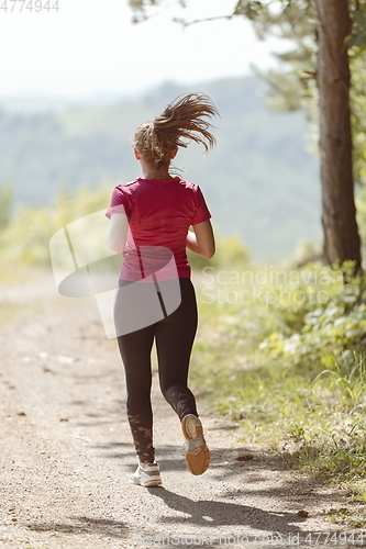 Image of woman enjoying in a healthy lifestyle while jogging