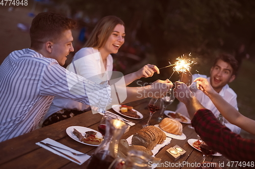 Image of french dinner party on summer