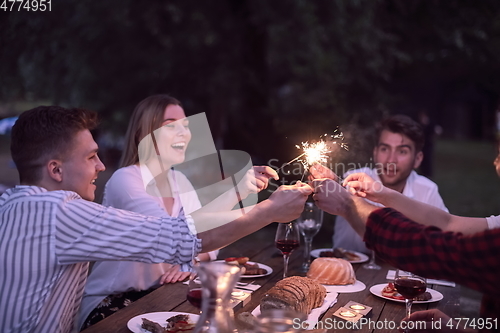Image of french dinner party on summer