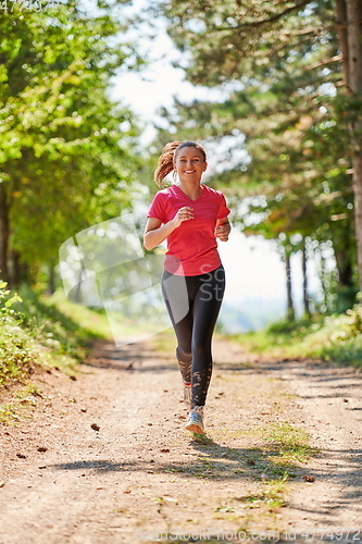 Image of woman enjoying in a healthy lifestyle while jogging