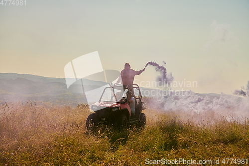 Image of  colorful torches while driving a off road buggy car