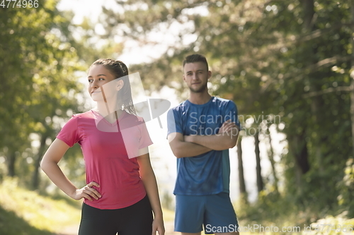 Image of young couple preparing for a morning run