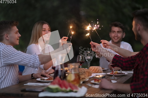 Image of french dinner party on summer