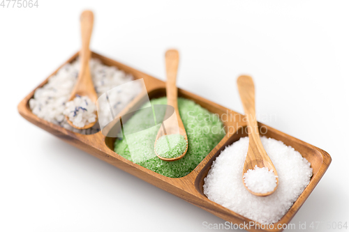 Image of sea salt and spoons on wooden tray