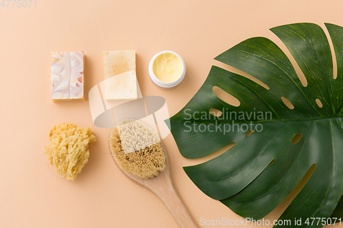 Image of natural soap, brush, sponge and body butter