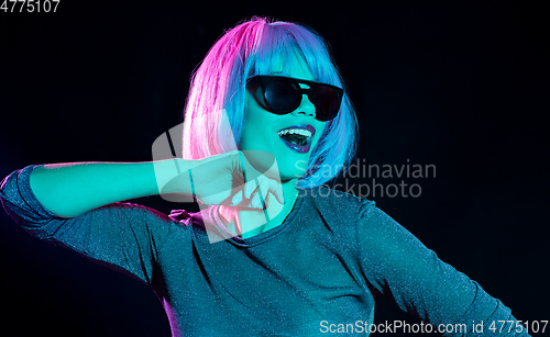 Image of happy woman in pink wig and black sunglasses