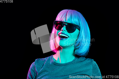 Image of happy woman in pink wig and black sunglasses