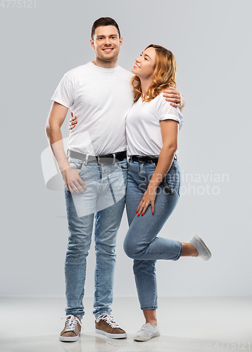 Image of portrait of happy couple in white t-shirts