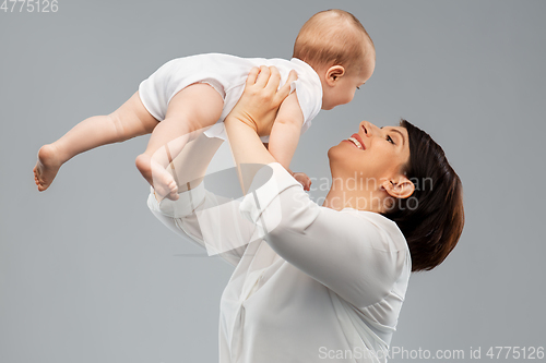 Image of happy middle-aged mother with little baby daughter