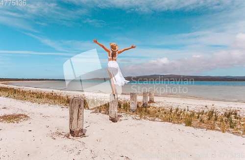 Image of Female joy freedom live life to the full travel beach concept