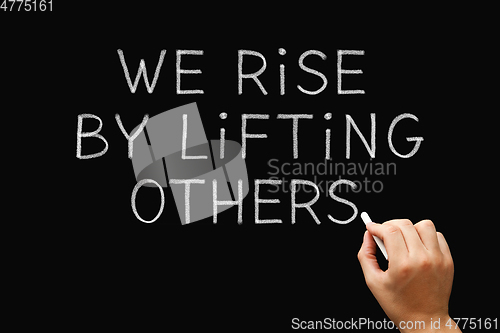 Image of We Rise By Lifting Others Teamwork Concept