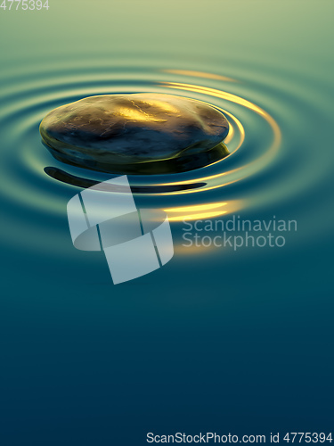 Image of pebble stone in water with ripples background