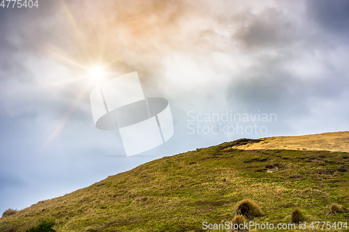 Image of hill and dramatic sky background