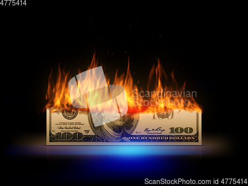 Image of a burning 100 dollar bill