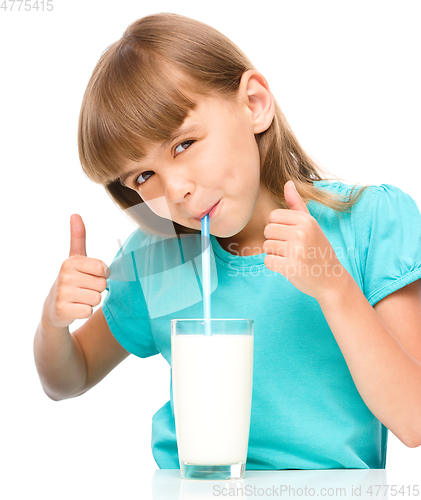 Image of Cute little girl with a glass of milk