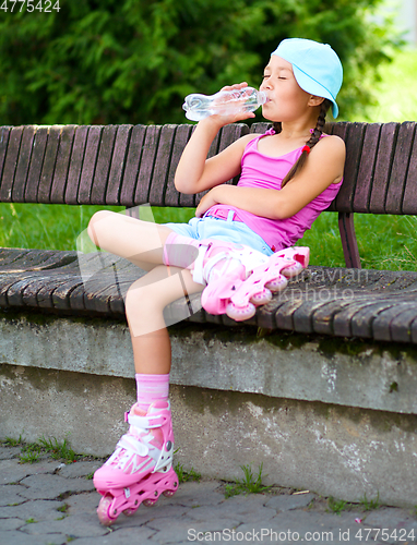 Image of Little girl is wearing roller-blades