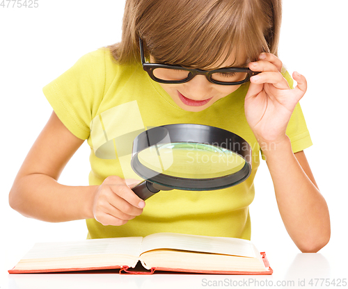 Image of Little girl is reading book