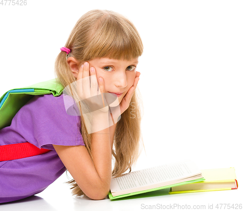 Image of Little girl is reading a book