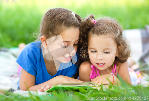 Image of Two little girls are reading book