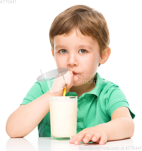 Image of Cute little boy with a glass of milk