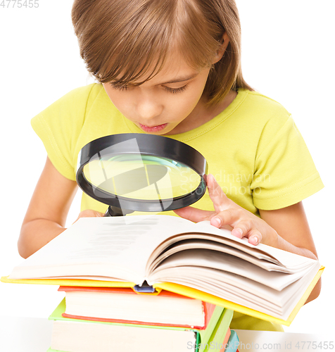 Image of Little girl is reading book