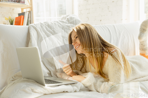 Image of Beautiful young woman relaxing at home, comfort and calm