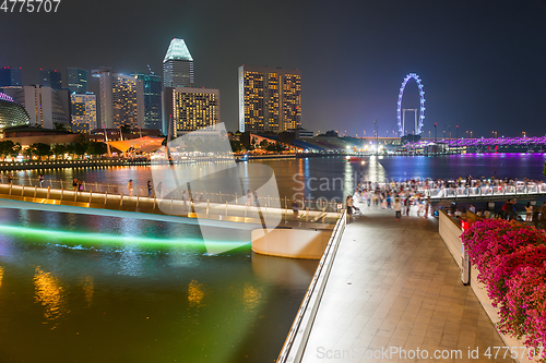 Image of Tourists walking Flyer Singapore embankment