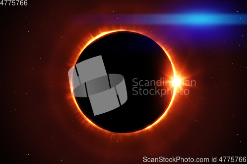 Image of total sun eclipse with stars and flare