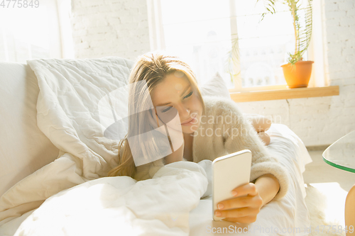 Image of Beautiful young woman relaxing at home, comfort and calm