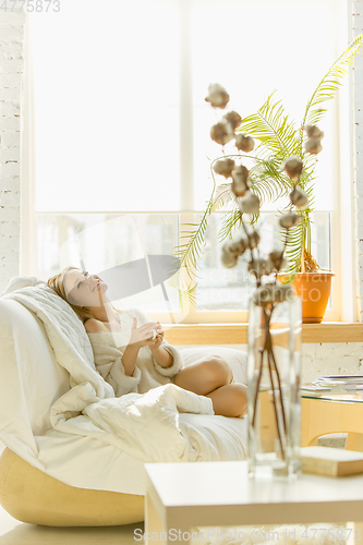 Image of Beautiful young woman relaxing at home, comfort and calm