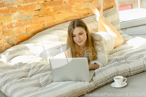 Image of Beautiful young woman relaxing at home, comfort and calm