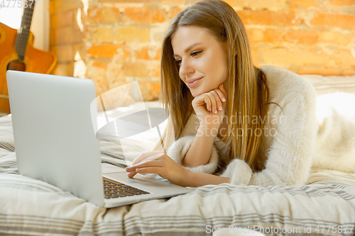 Image of Beautiful young woman relaxing at home, comfort and calm