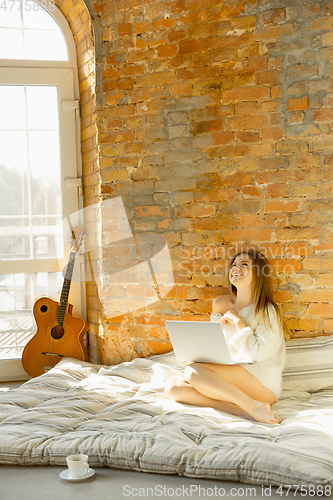 Image of Beautiful young woman relaxing at home, comfort and calm