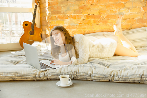 Image of Beautiful young woman relaxing at home, comfort and calm