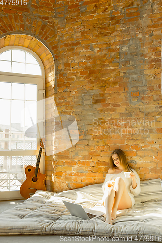 Image of Beautiful young woman relaxing at home, comfort and calm