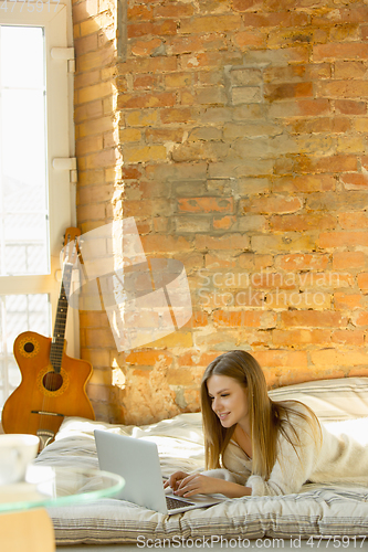 Image of Beautiful young woman relaxing at home, comfort and calm