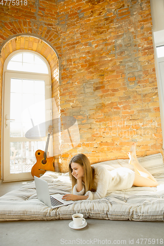 Image of Beautiful young woman relaxing at home, comfort and calm