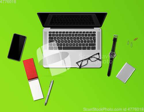 Image of Office desk mockup top view isolated on green