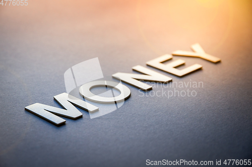 Image of Word money written with white solid letters