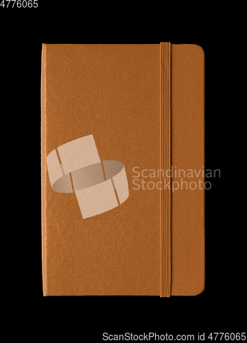 Image of Leather closed notebook isolated on black