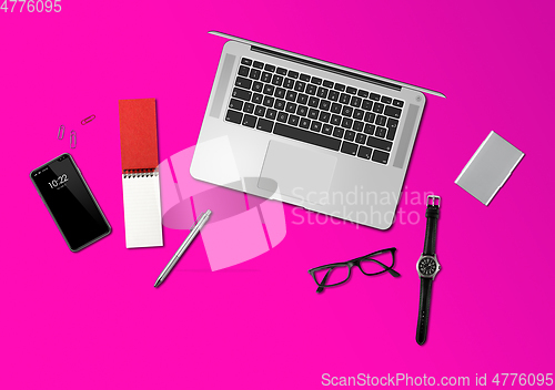 Image of Office desk mockup top view isolated on magenta pink