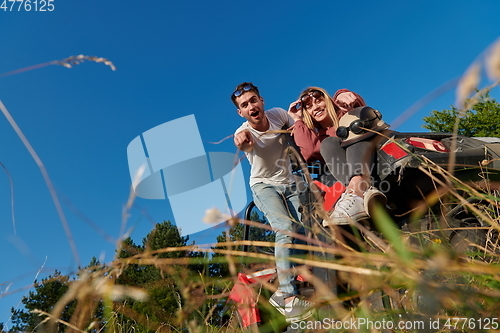 Image of couple enjoying beautiful sunny day while driving a off road buggy