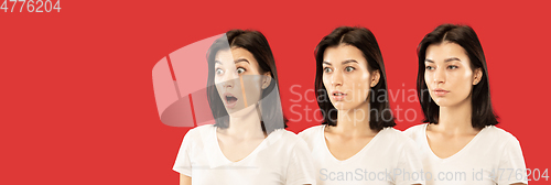 Image of Caucasian young woman\'s close up portrait on red background