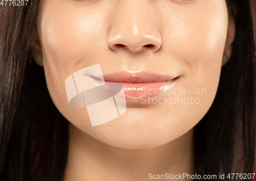 Image of Beautiful young woman\'s full lips close-up, perfect skincare concept