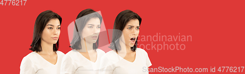 Image of Caucasian young woman\'s close up portrait on red background