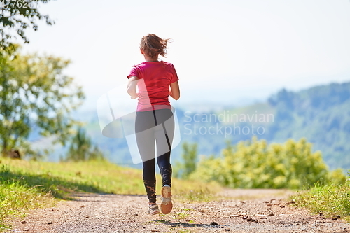 Image of woman enjoying in a healthy lifestyle while jogging
