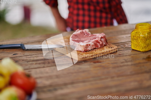 Image of man cooking tasty food for french dinner party